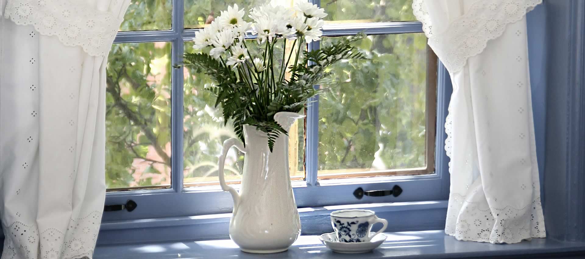 brafferton inn specials flower vase in window with tea cup