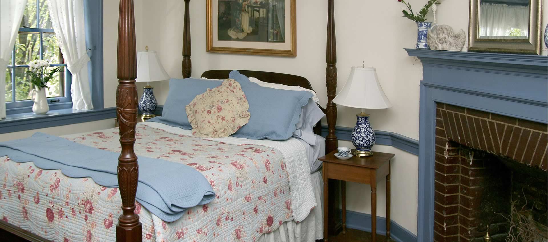 bed and fireplace of the Old master bedroom