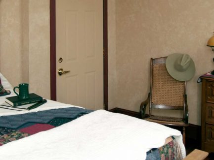 Officer Quarters bed and dresser, chair and hat